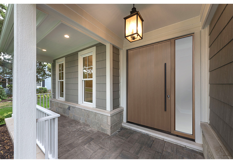 Puerta exterior pivotante en madera y vidrio de gran formato